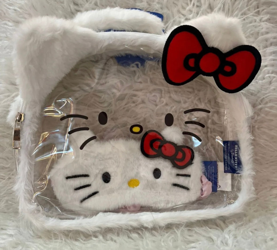 Necesserie grande hello kitty transparente pelúcia + tapa olho